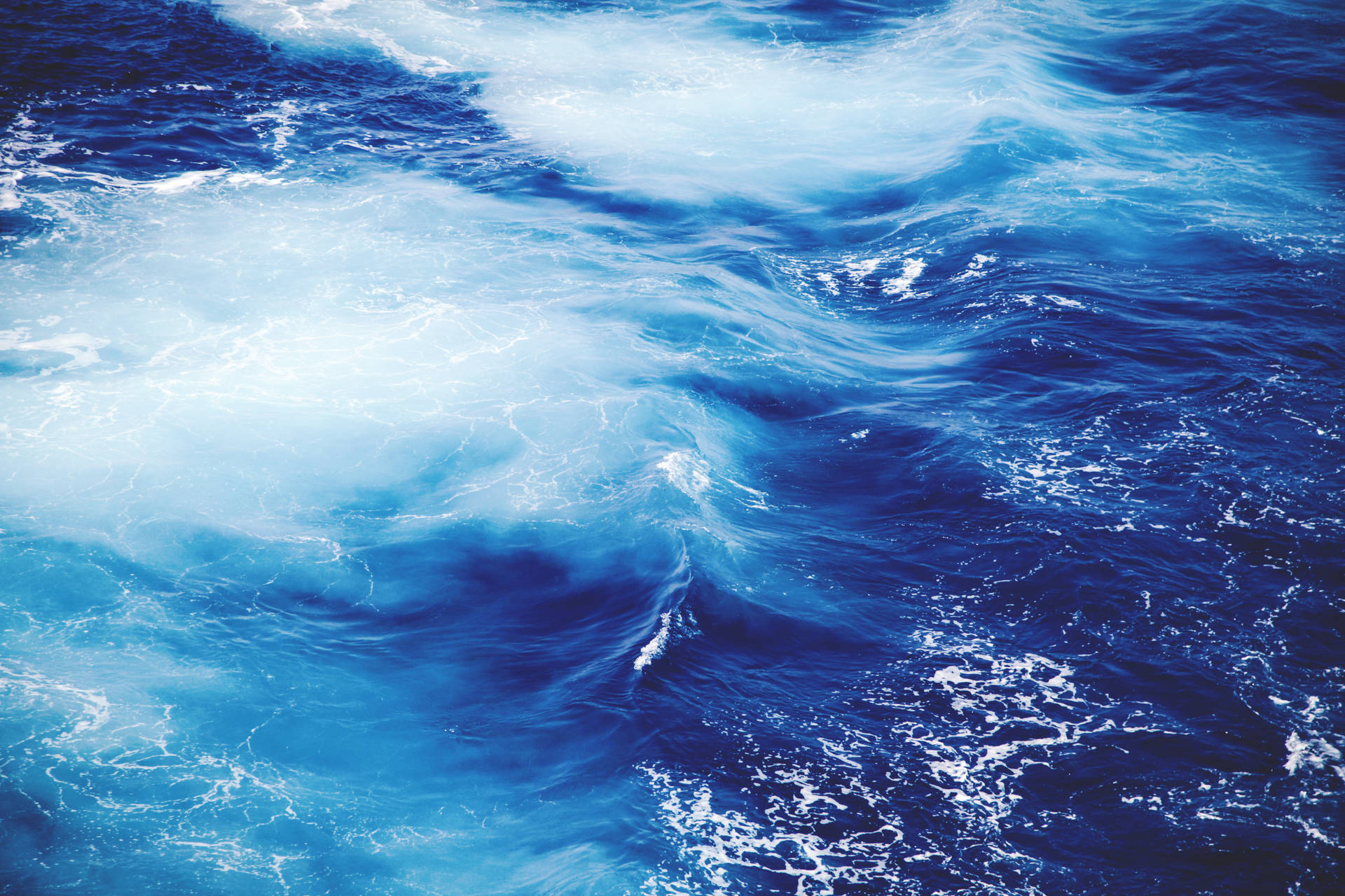 Blue Sea With White Sea Foam Wallpaper