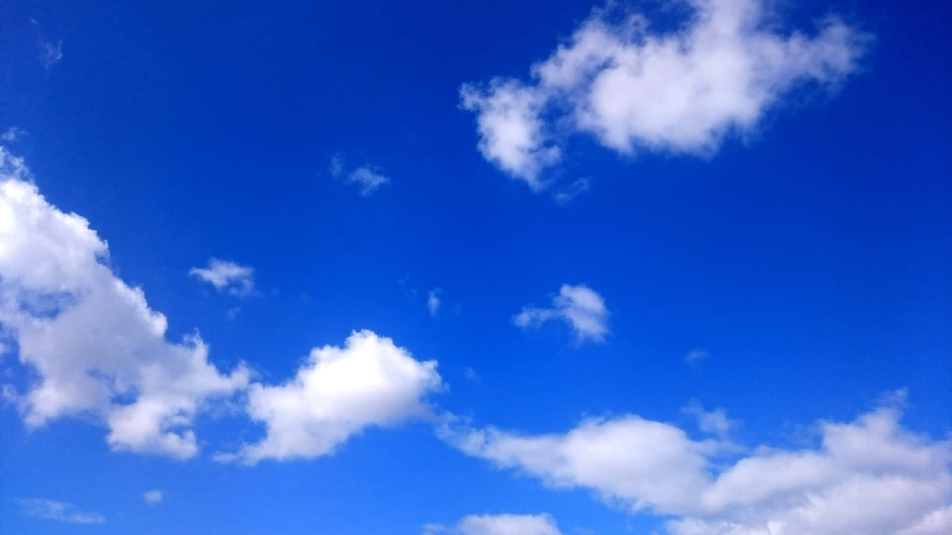 A Blue Sky With White Clouds And Blue Sky