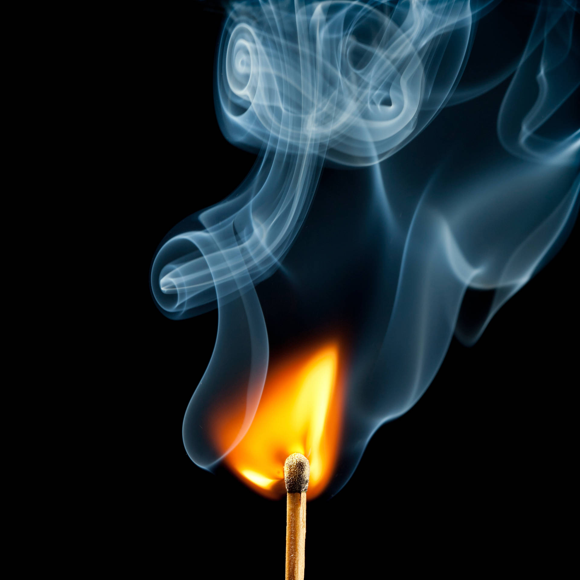 A Cascading Blue Smoke Rises Against a Black Background Wallpaper