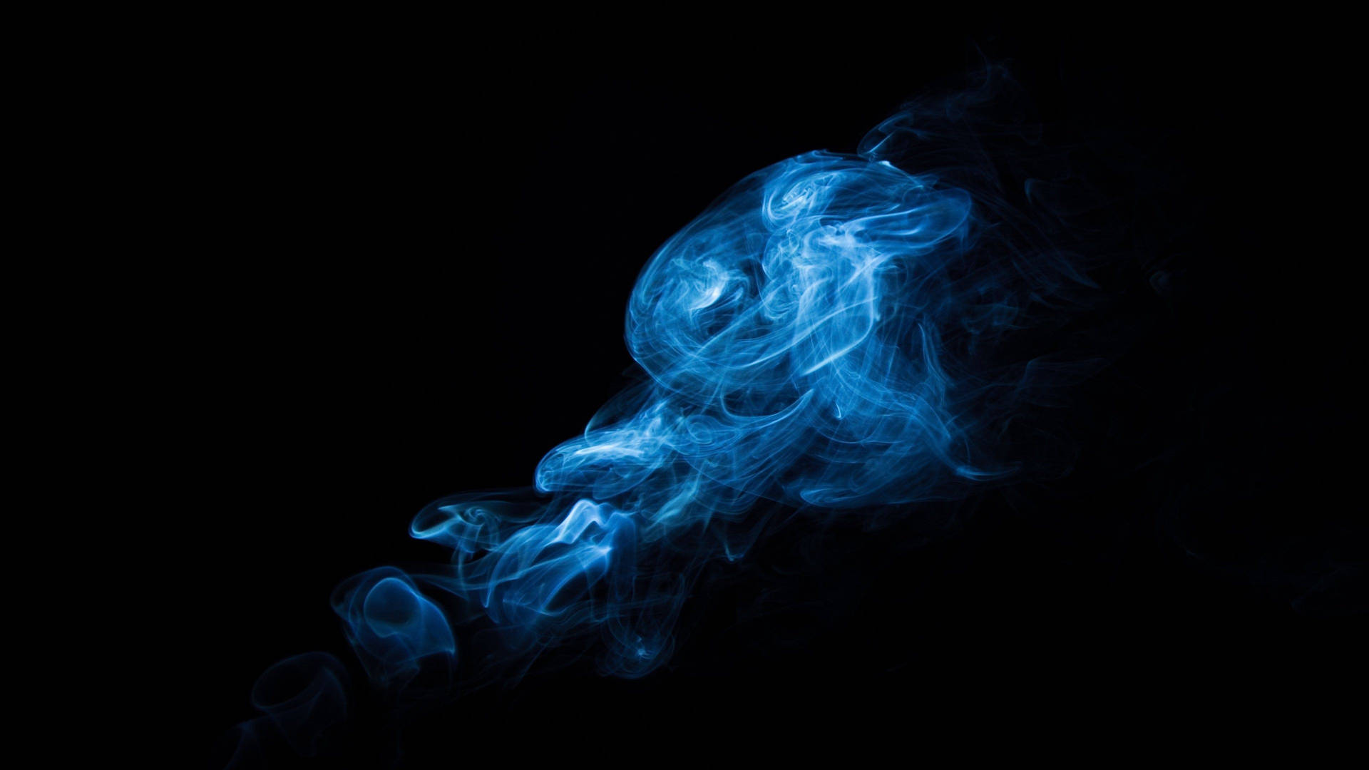 Caption: Majestic Blue Smoke with Striking White Streaks Wallpaper