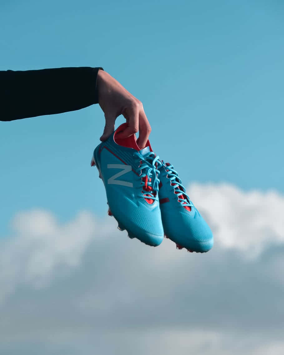 Blue Soccer Cleats Sky Background Wallpaper
