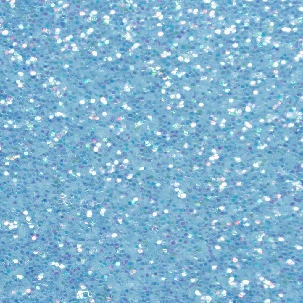 A Blue Glittery Background With White And Blue Glitter