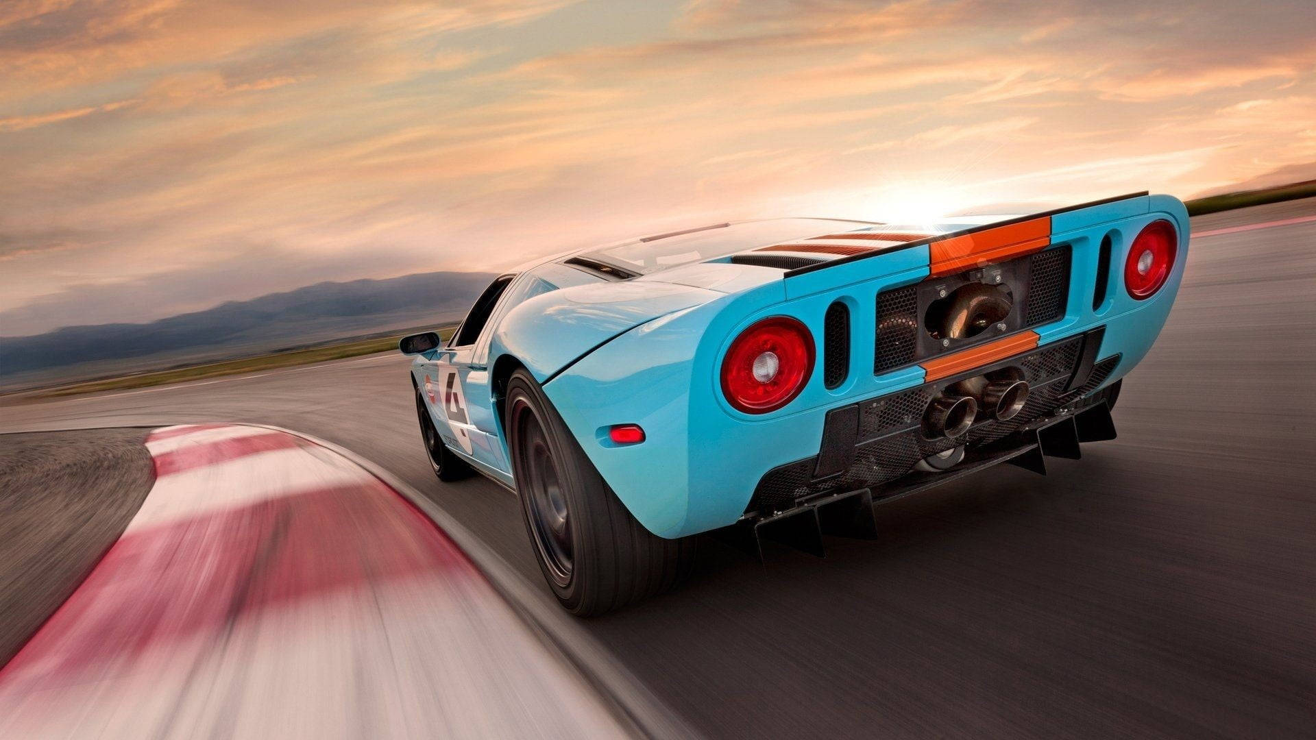 Blue Sports Car On The Road Wallpaper