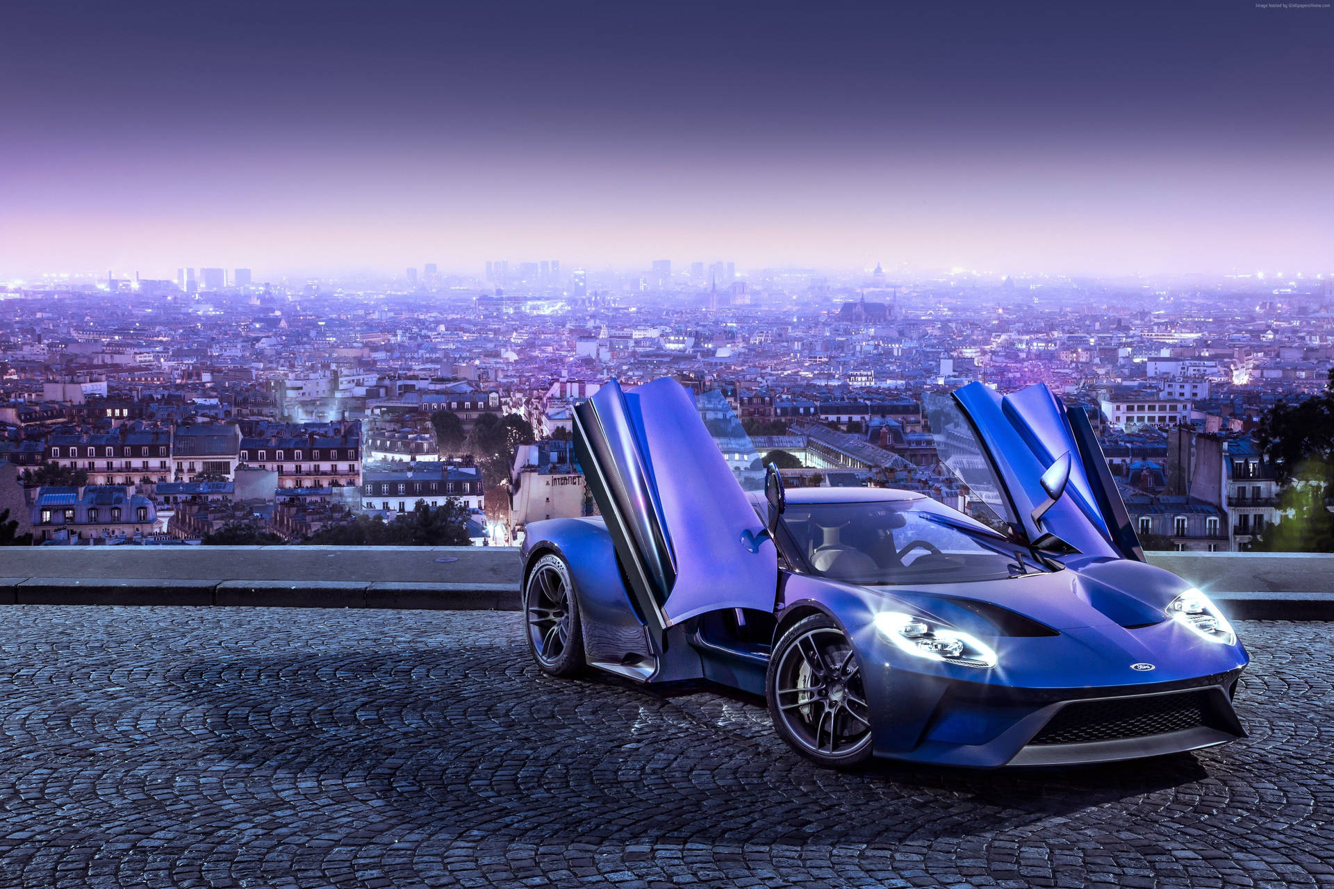Stunning Blue Sports Car With Butterfly Doors Wallpaper