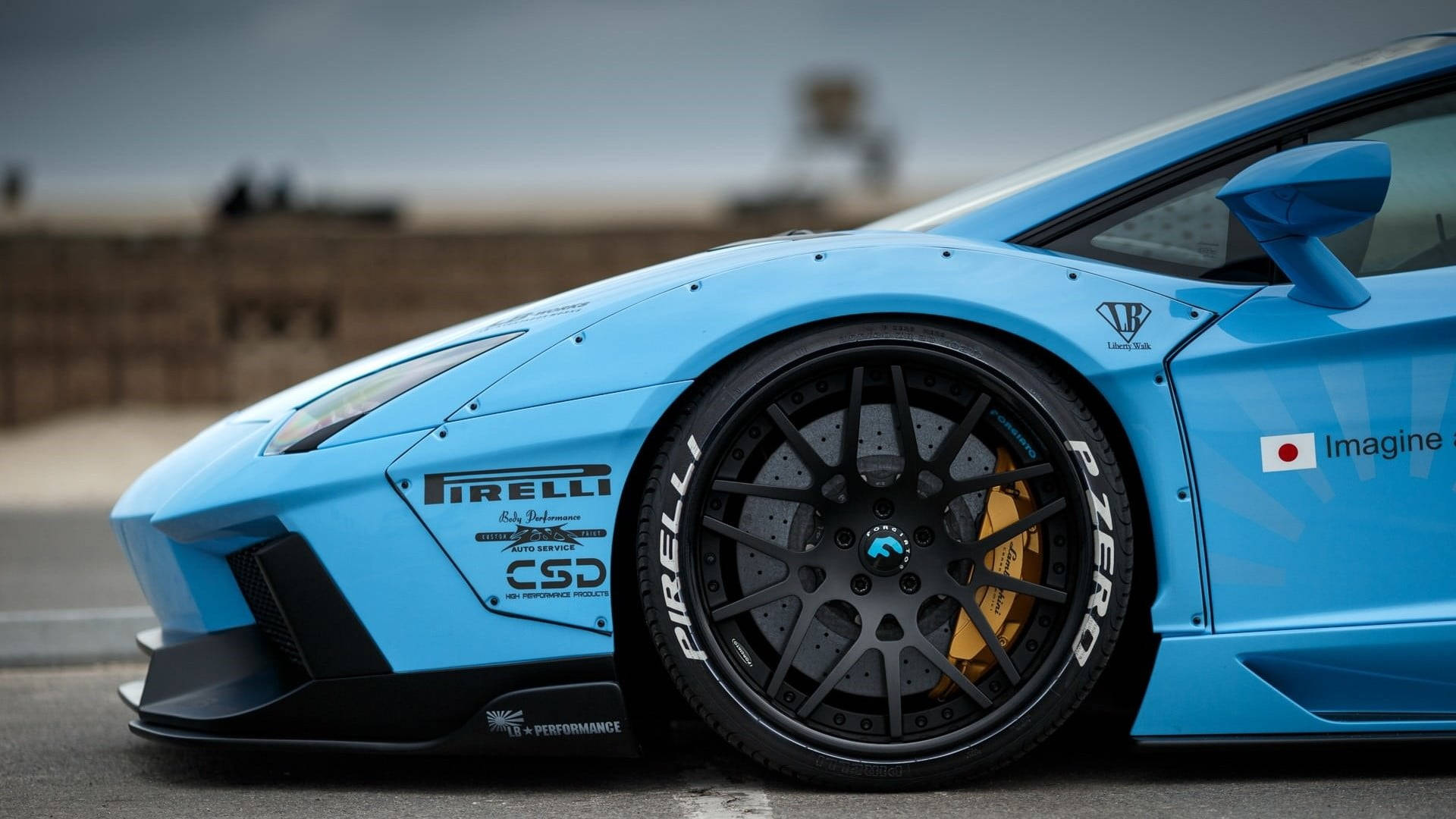 Blauersportwagen Mit Pirelli Reifen. Wallpaper