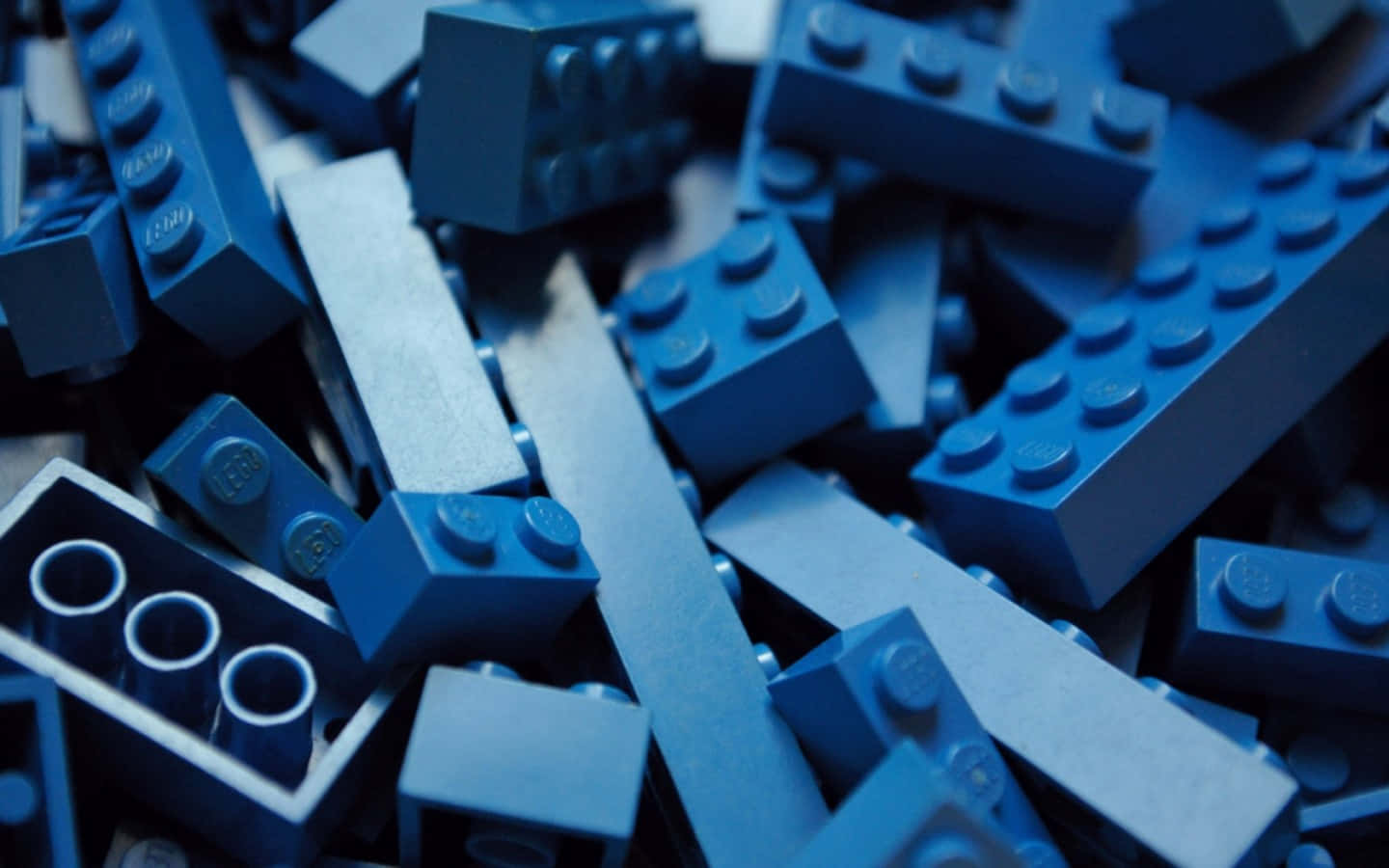 A Pile Of Blue Lego Blocks Wallpaper