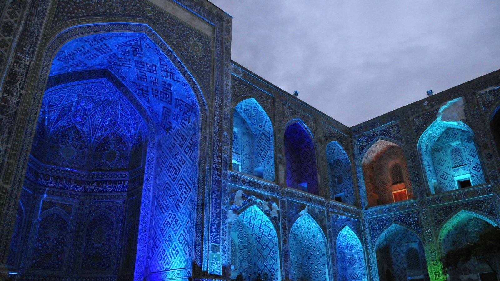 Stunning view of historical Ulugh Beg Madrasa in Samarkand under crystal clear blue sky Wallpaper