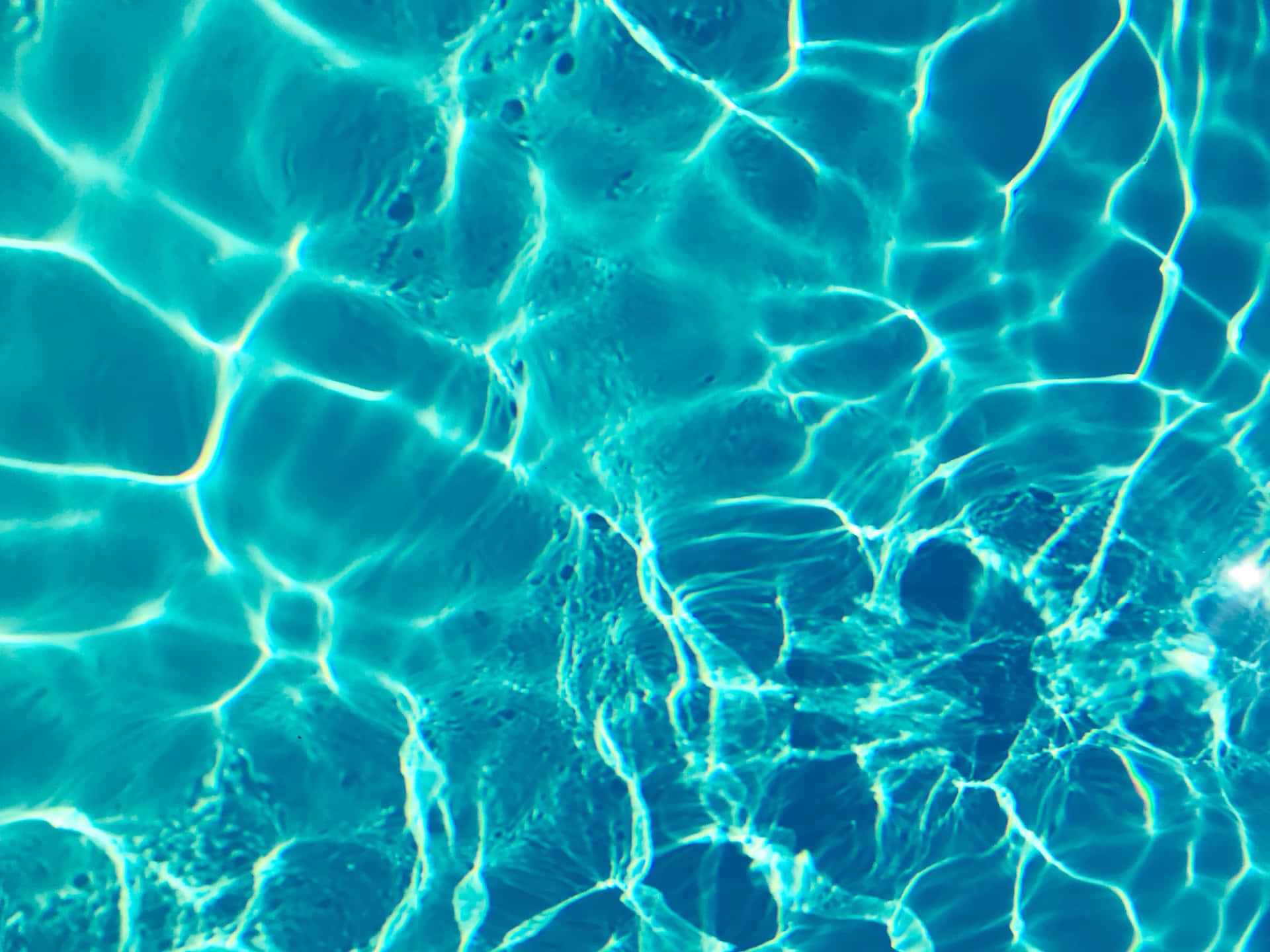 A Close Up Of A Blue Pool With Clear Water