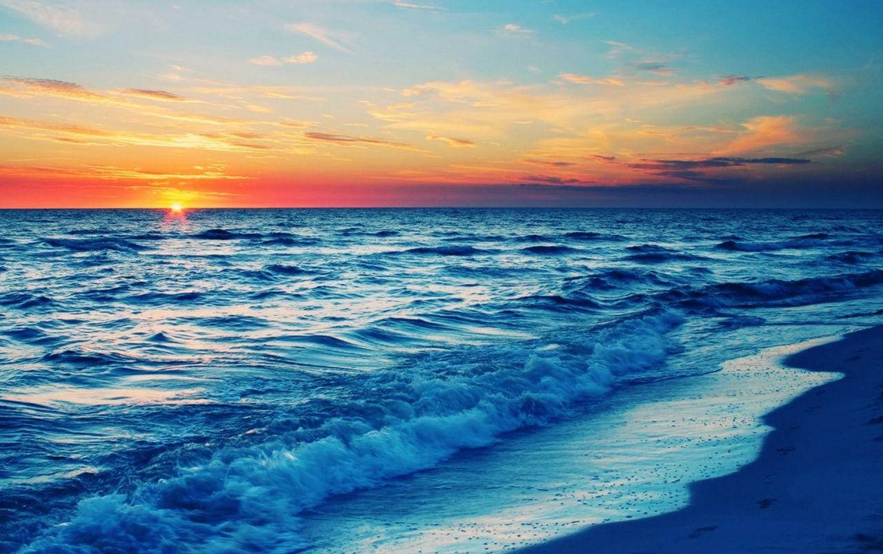 Blue Waves On Beach Sunset Wallpaper