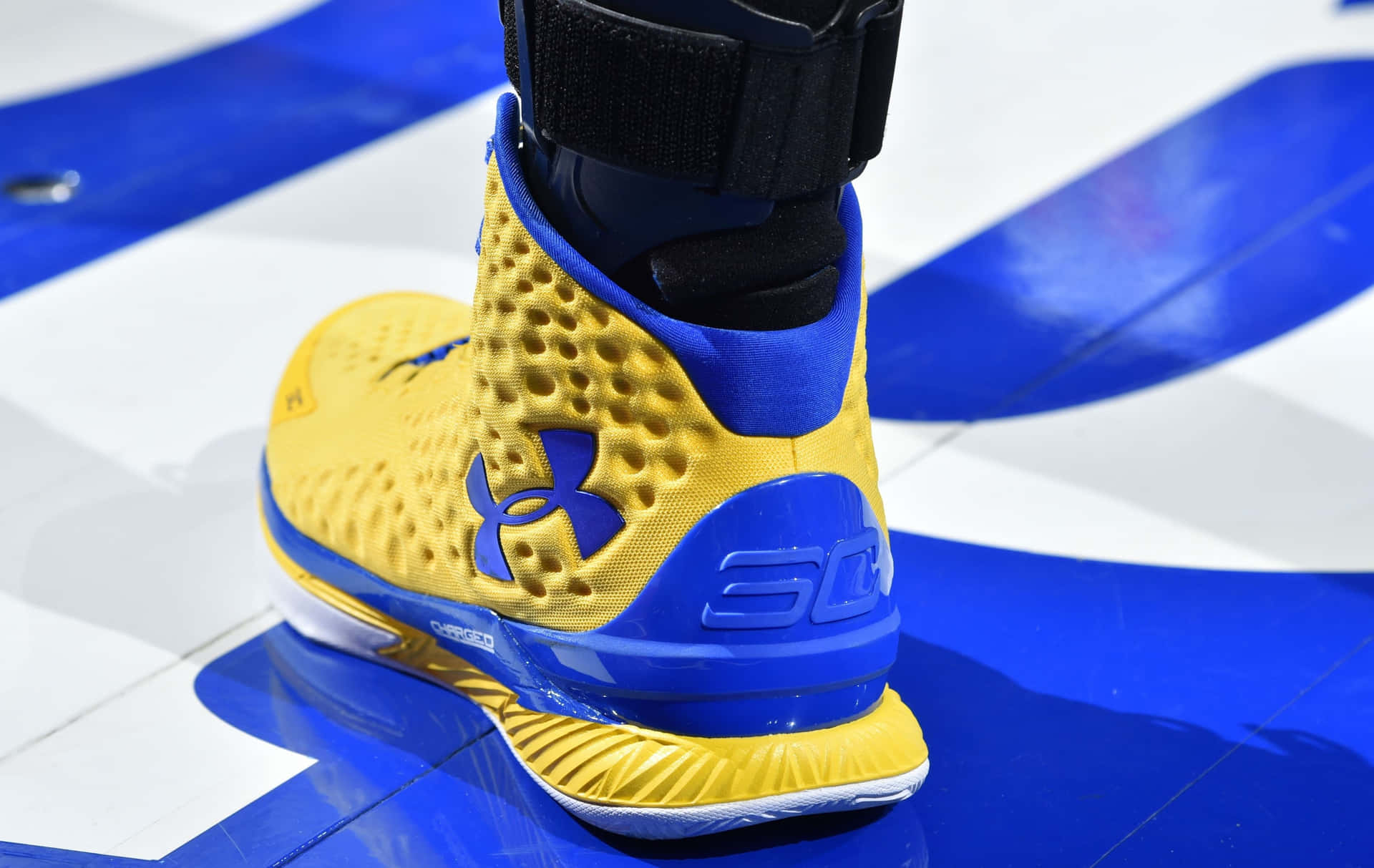 Blueand Yellow Basketball Shoe Wallpaper