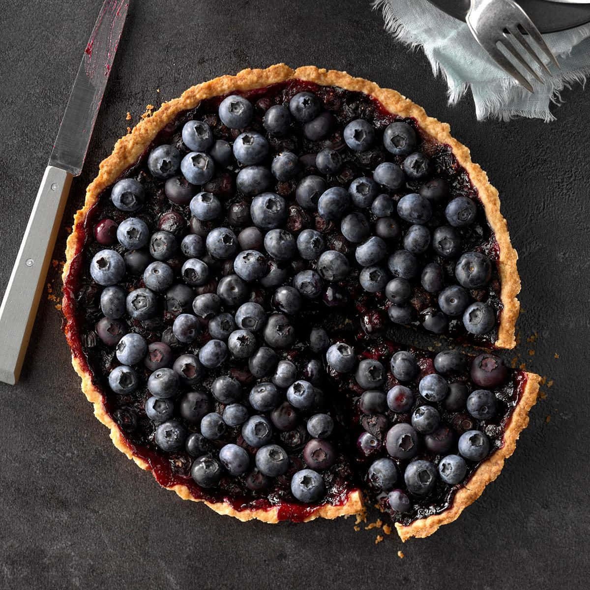 Enjoy a sweet and juicy blueberries tart Wallpaper