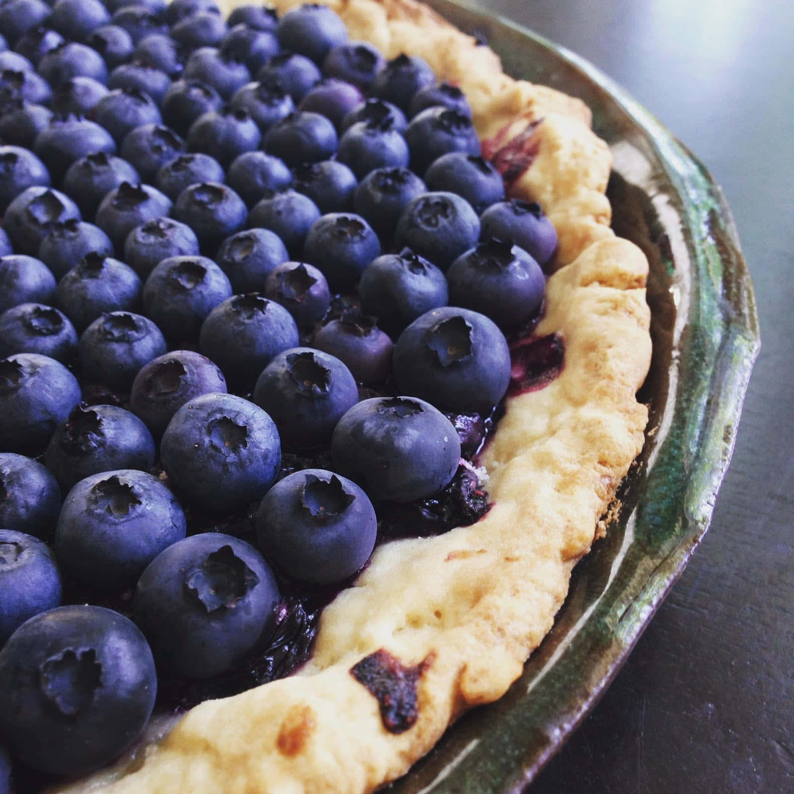 A delicious slice of homemade blueberry tart Wallpaper