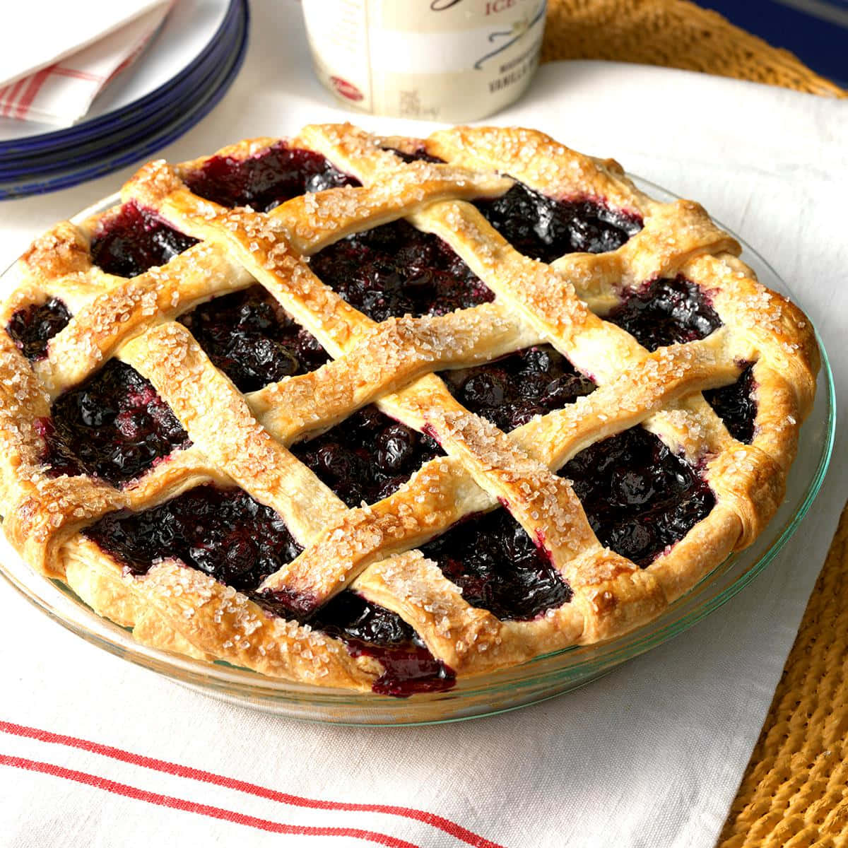 "Tantalizingly sweet and delicious, a freshly prepared Blueberry Pie topped with vanilla ice cream - heavenly! Wallpaper