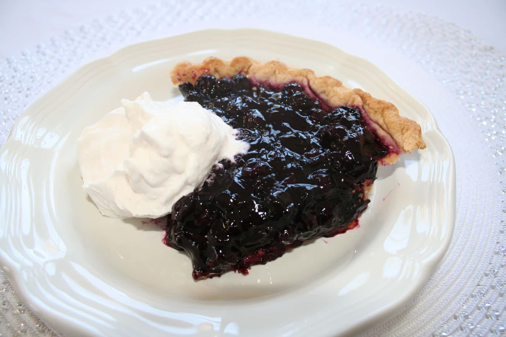 A delicious homemade blueberry pie hot out of the oven. Wallpaper