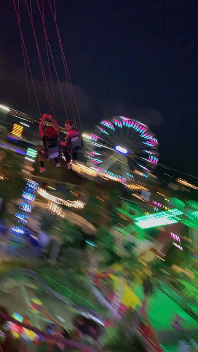 Blurry Amusement Park At Night Picture