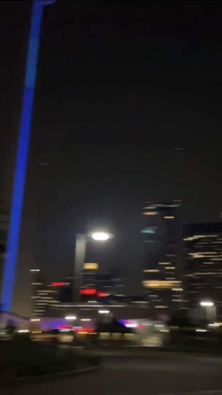 Blurry City At Night With City Lights Picture