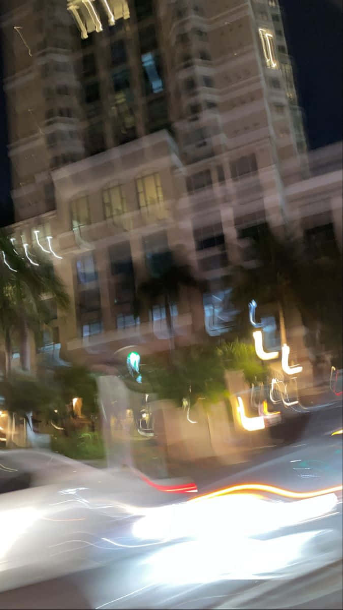 Blurry Fancy Building In City At Night Picture