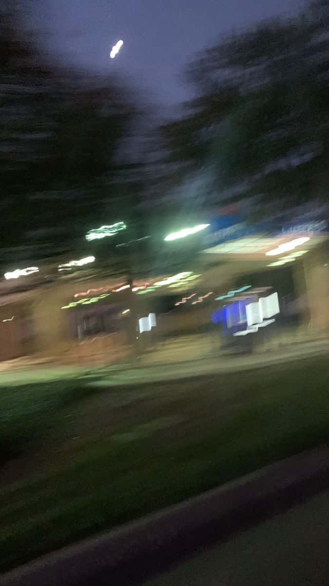 Blurry Small Building At Night Picture