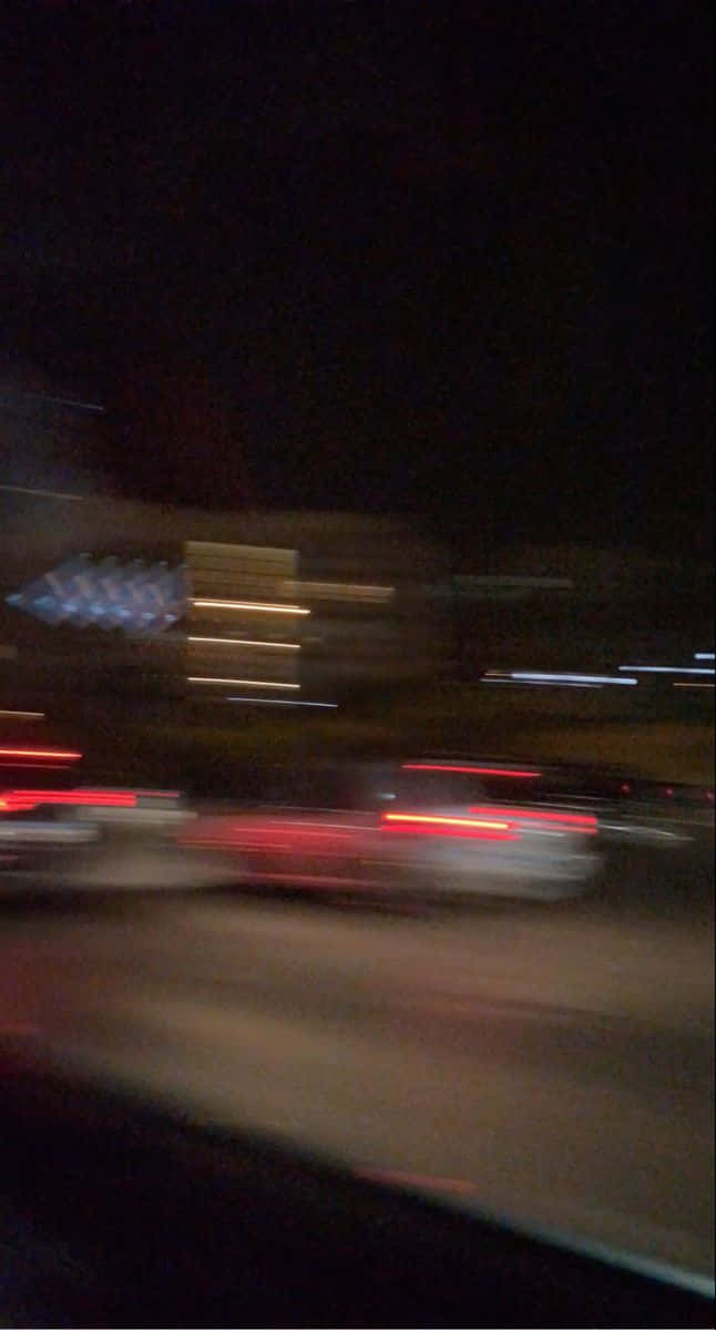 Blurry Cars On Road At Night Picture