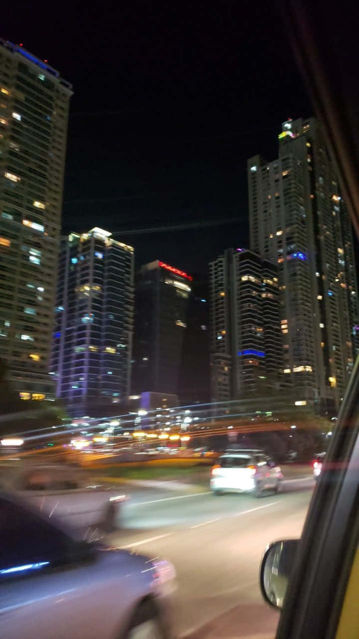 Blurry Cars Zooming Past Buildings Picture