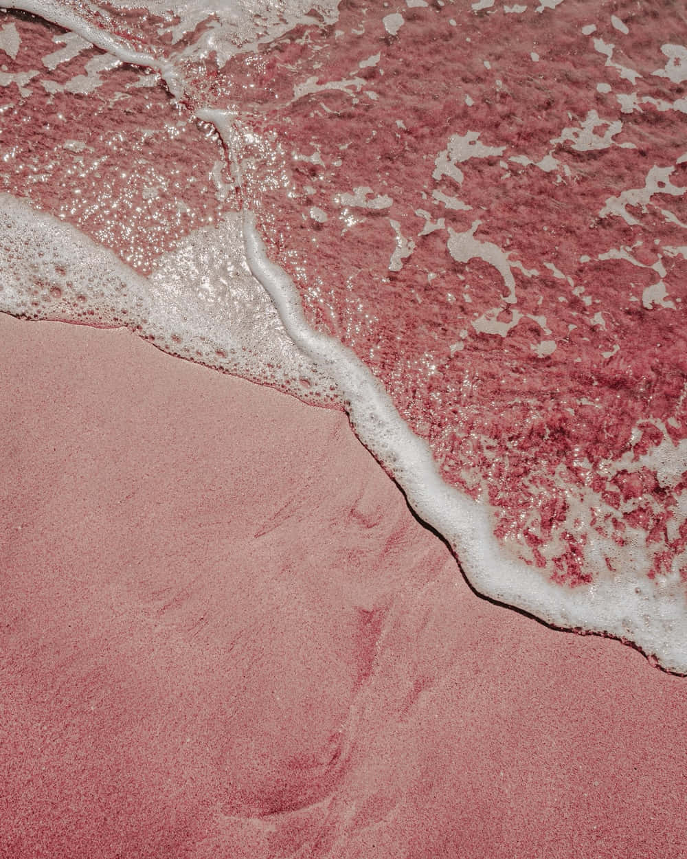 Acquadi Mare Su Sfondo Di Sabbia Color Rosa Cipria