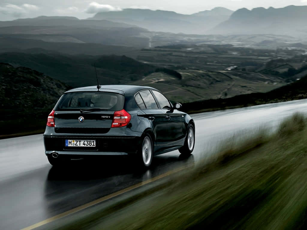 Sleek BMW 1 Series in action Wallpaper