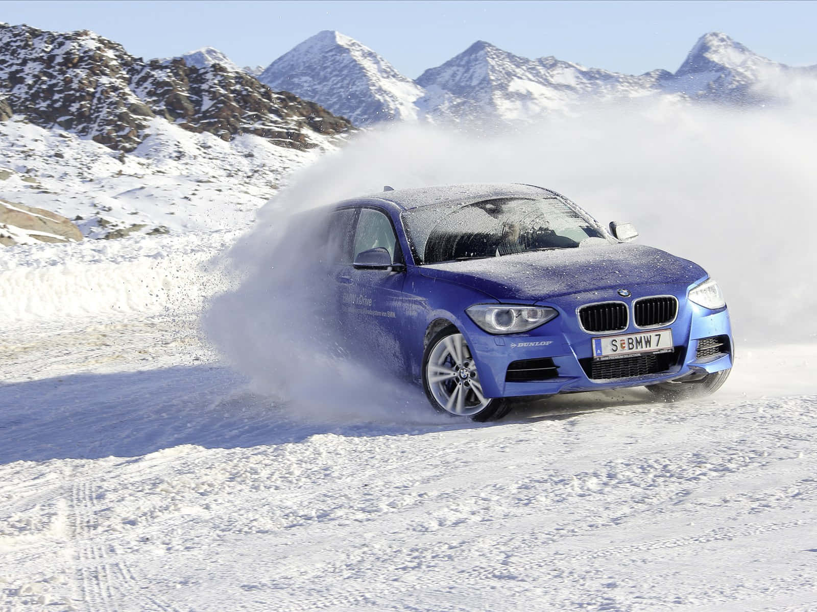 Sleek and stylish BMW 1 Series in a stunning outdoor setting. Wallpaper