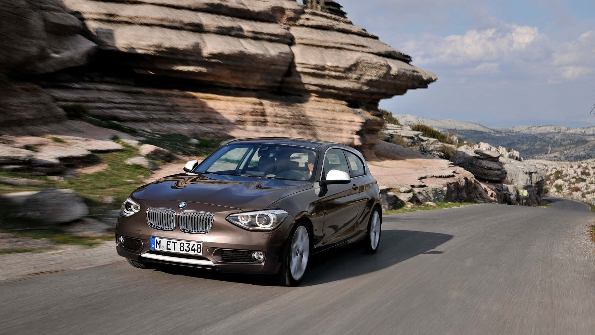 Sleek and Sporty BMW 1 Series in Action Wallpaper