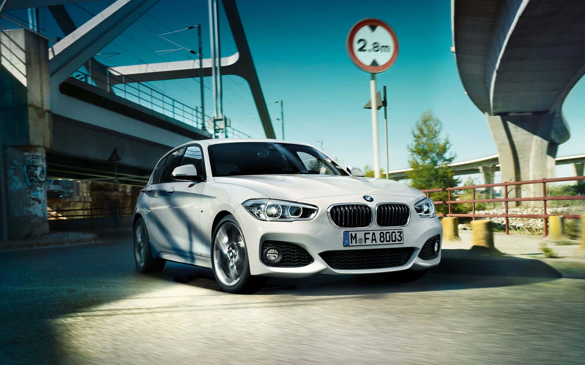 BMW 1 Series impressively cruising on the open road. Wallpaper