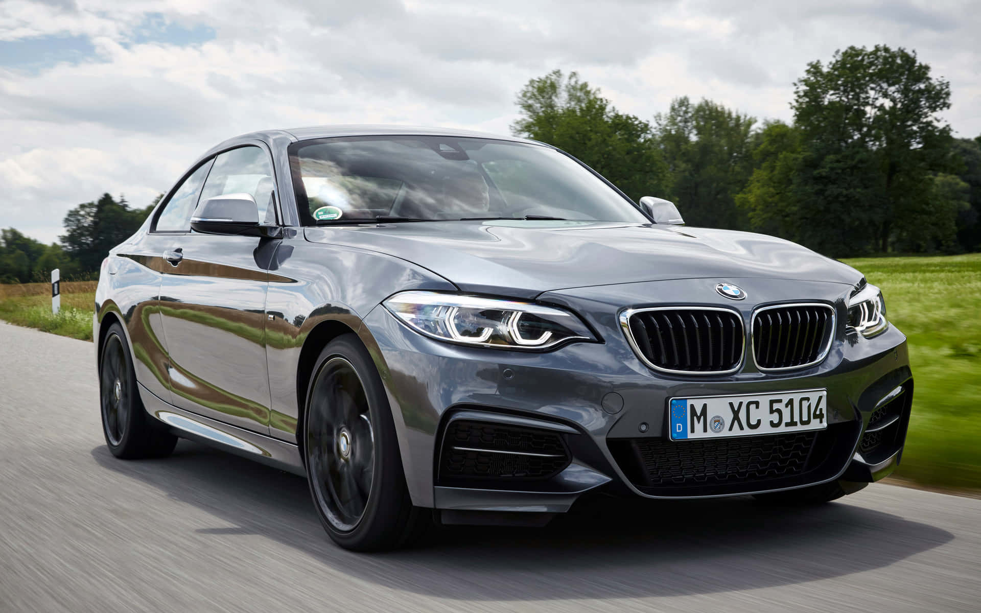 Sleek and Stylish BMW 2 Series in Motion Wallpaper