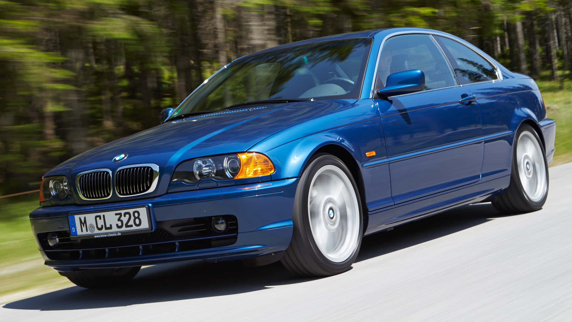 Elegant BMW 3 Series in Motion Wallpaper