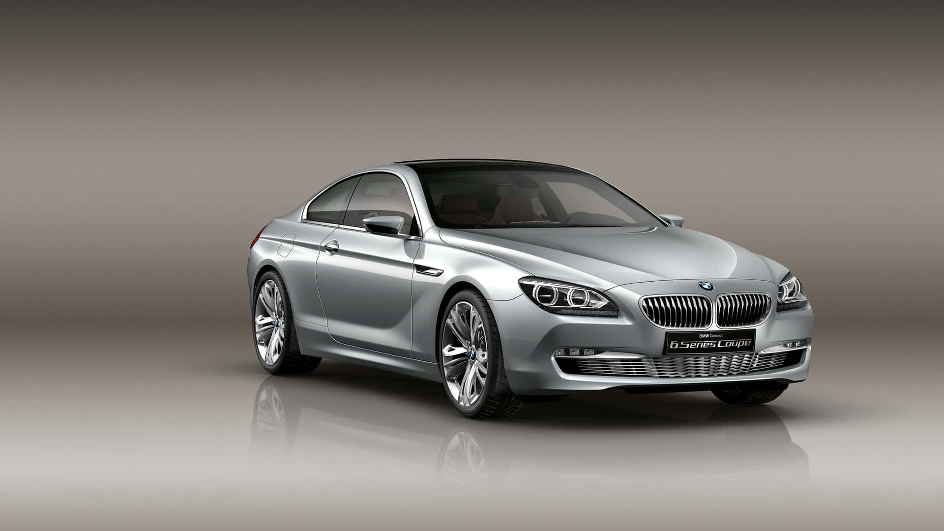 Caption: Sleek BMW 6 Series Cruising on the Open Road Wallpaper