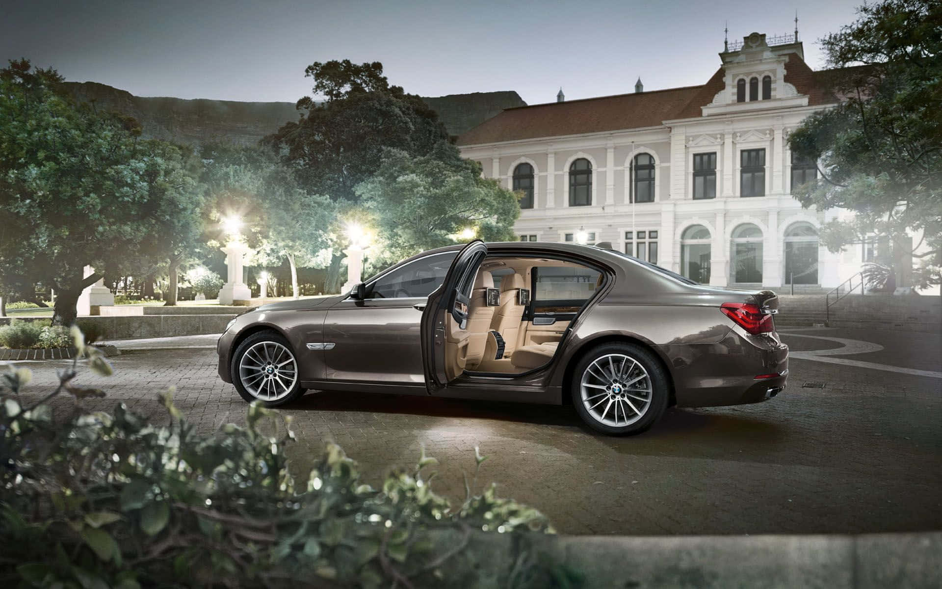 Exquisite BMW 7 Series Luxury Sedan in Natural Setting Wallpaper