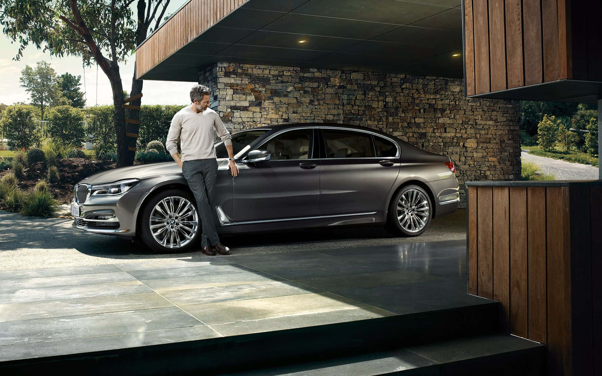 Caption: Sleek and Stylish BMW 7 Series in Motion Wallpaper