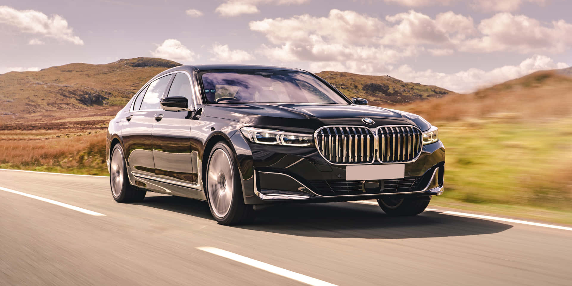 Sleek and Luxurious BMW 7 Series in Motion Wallpaper