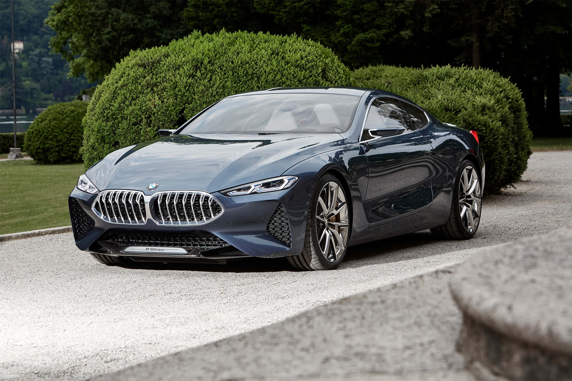 Sleek BMW 8 Series Coupe on the Road Wallpaper