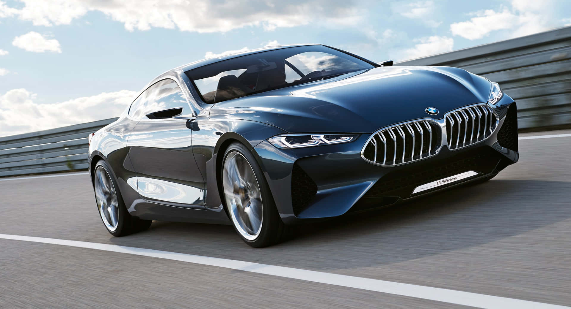 Sleek BMW 8 Series luxury sports coupe parked in an urban setting Wallpaper