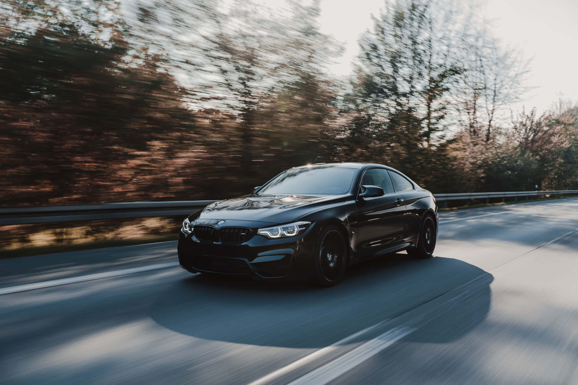 "Experience the Luxury of BMW, The Ultimate Driving Machine" Wallpaper