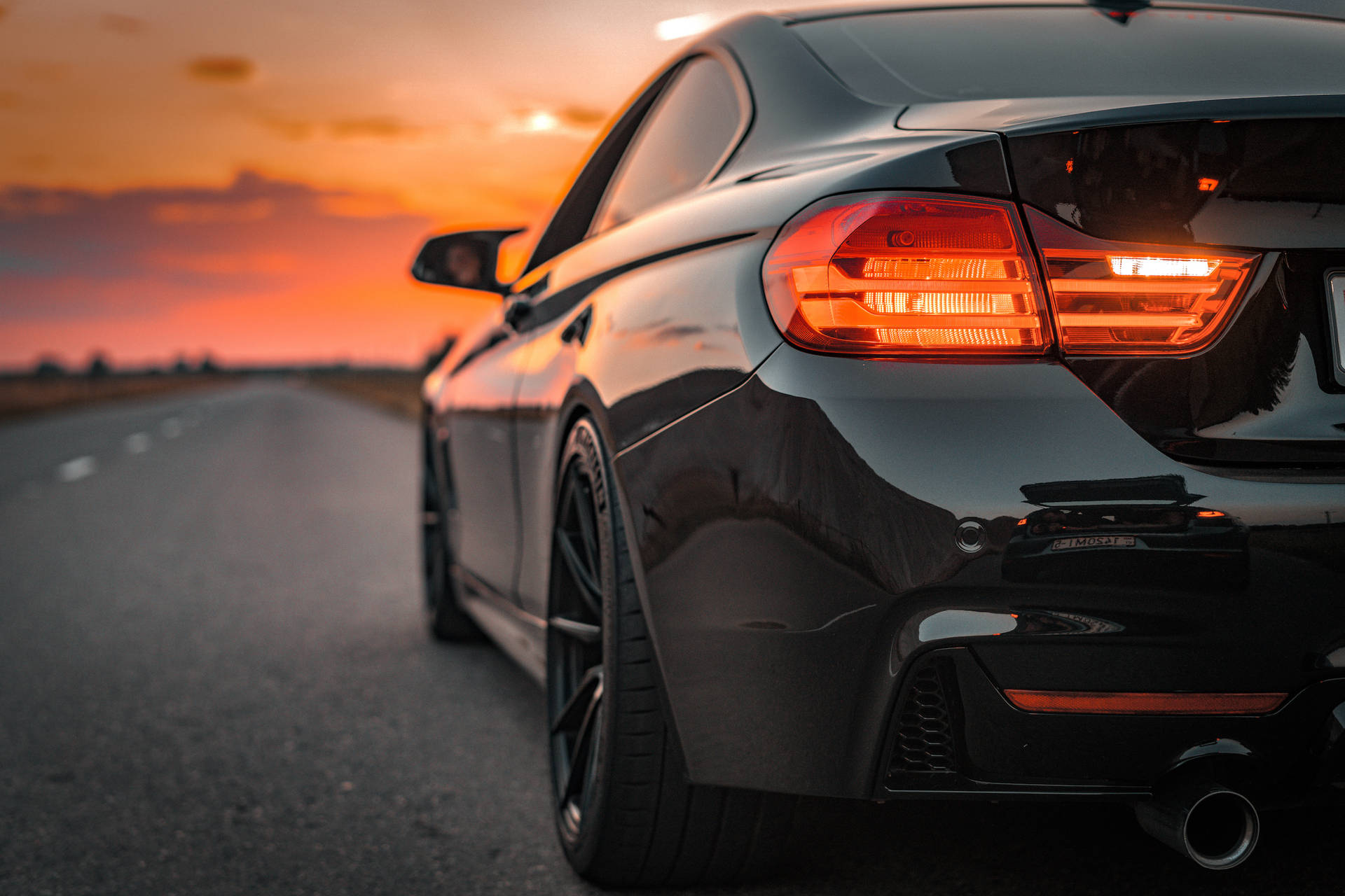 BMW M In A Road At Sunset Wallpaper