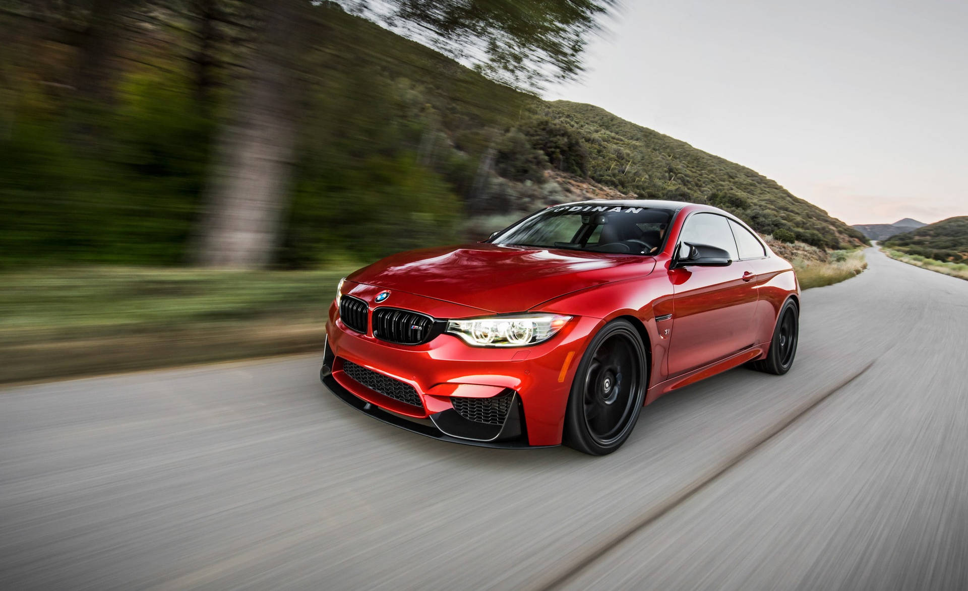 BMW M4 Zooming On The Road Wallpaper