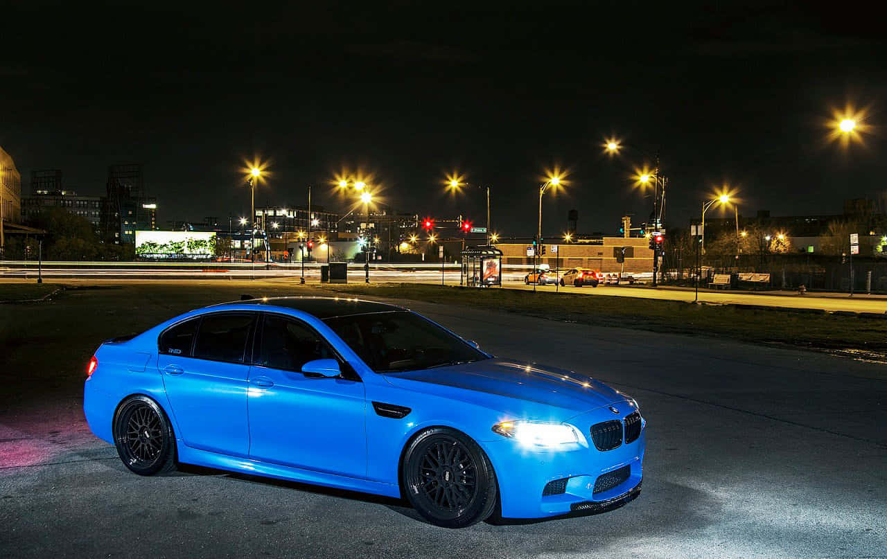 Sleek BMW M5 in motion on the open road Wallpaper