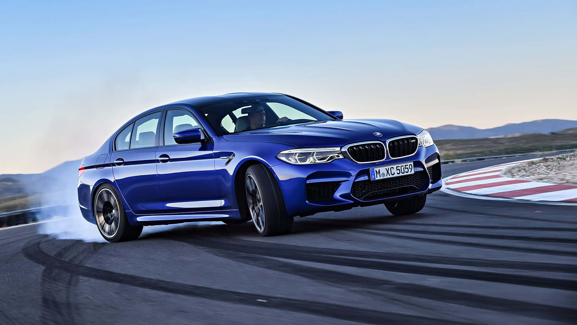 Sleek and Powerful BMW M5 in Action Wallpaper