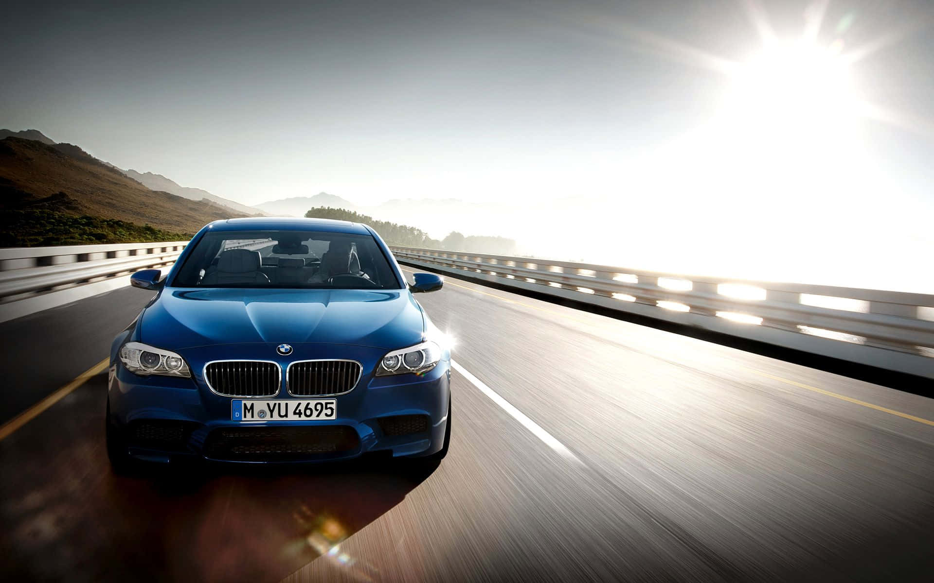 Dominating the Road - BMW M5 in Action Wallpaper