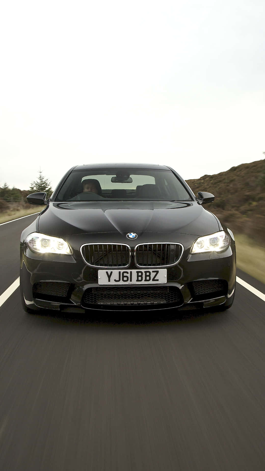 "Experience the luxury of driving a BMW M5 in breathtaking 4K detail" Wallpaper
