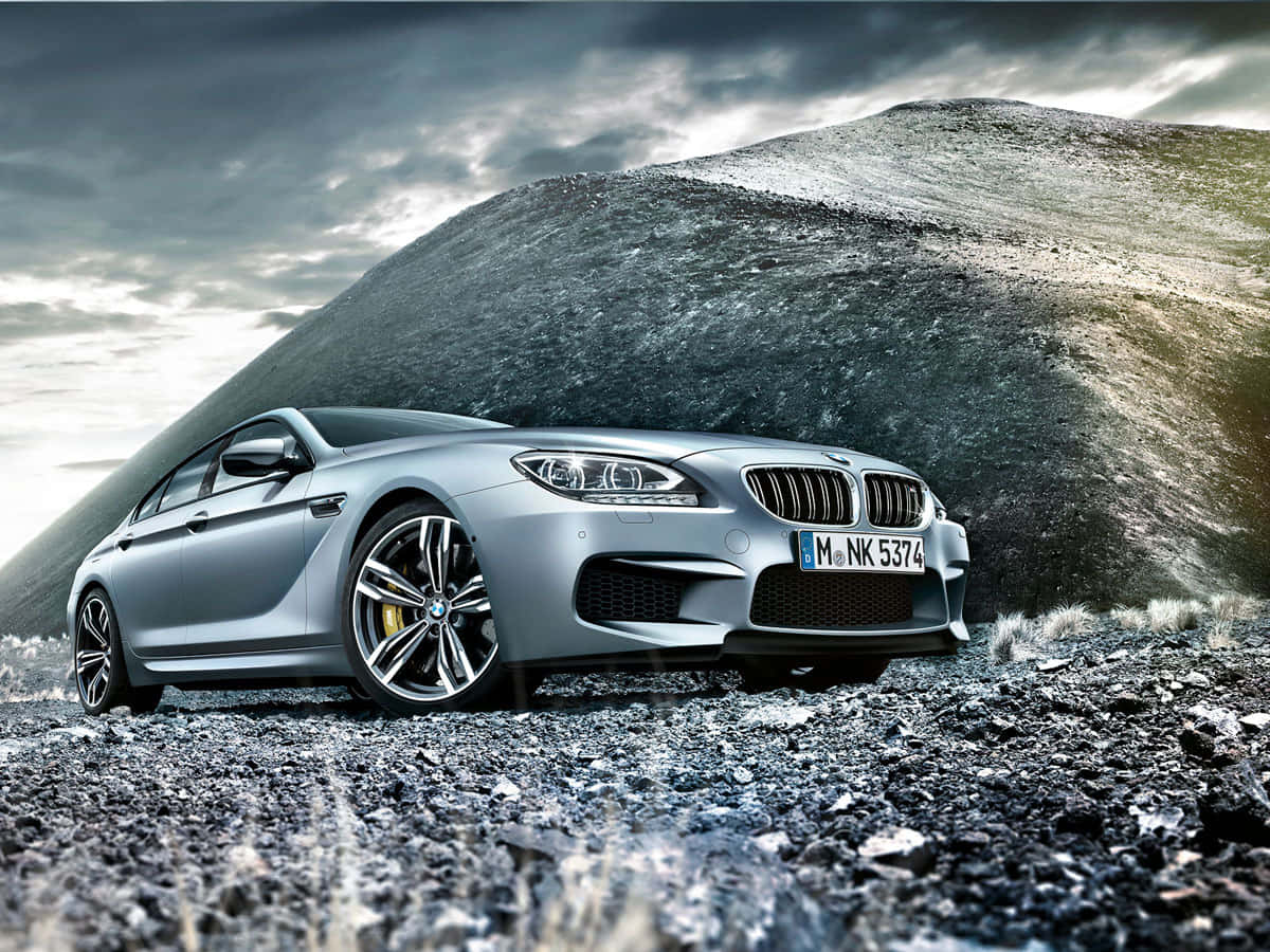 Sleek BMW M6 in a Vibrant Cityscape Wallpaper