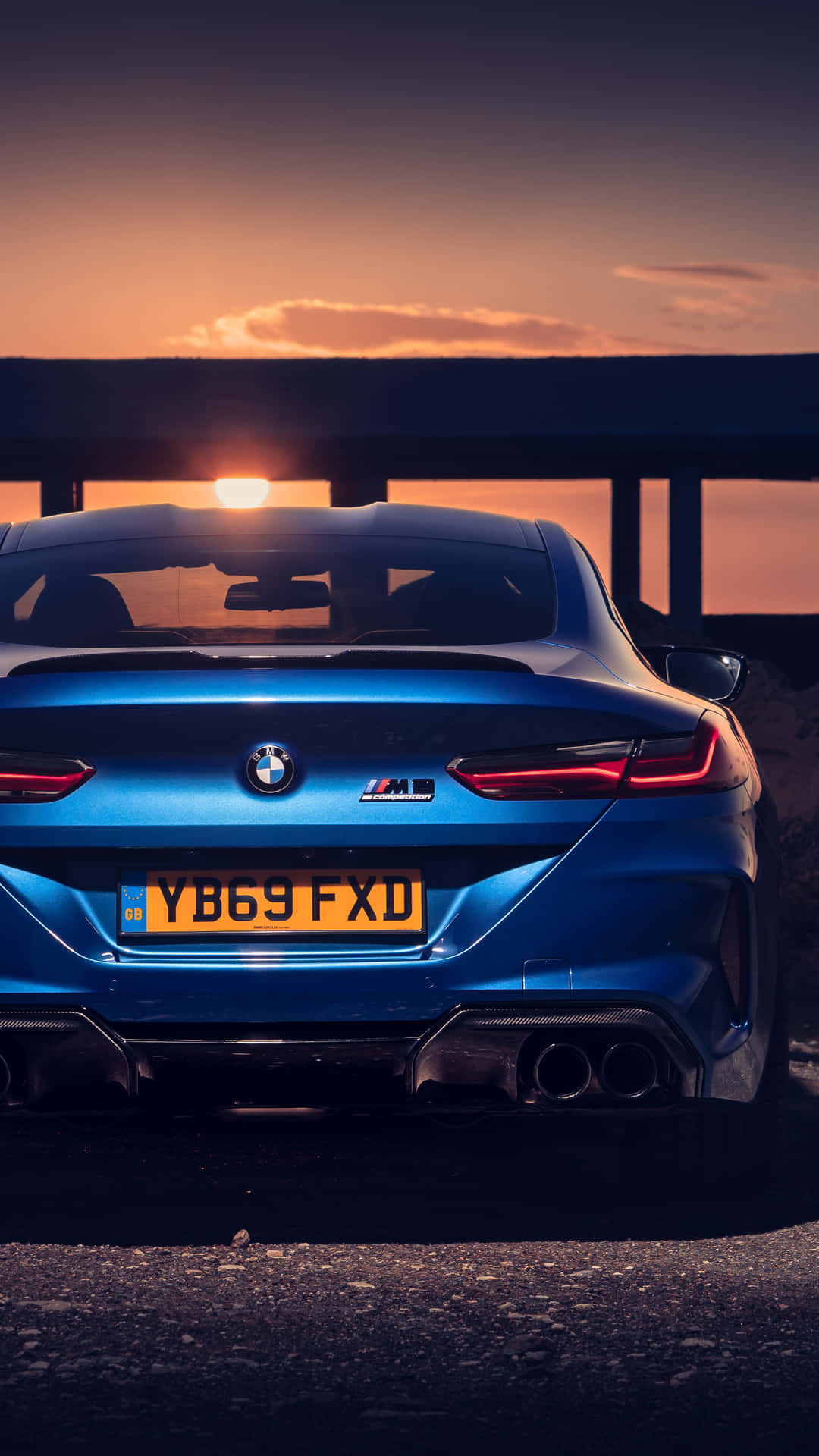 Blue Bmw M8 4k Mobile By The Sunset Wallpaper