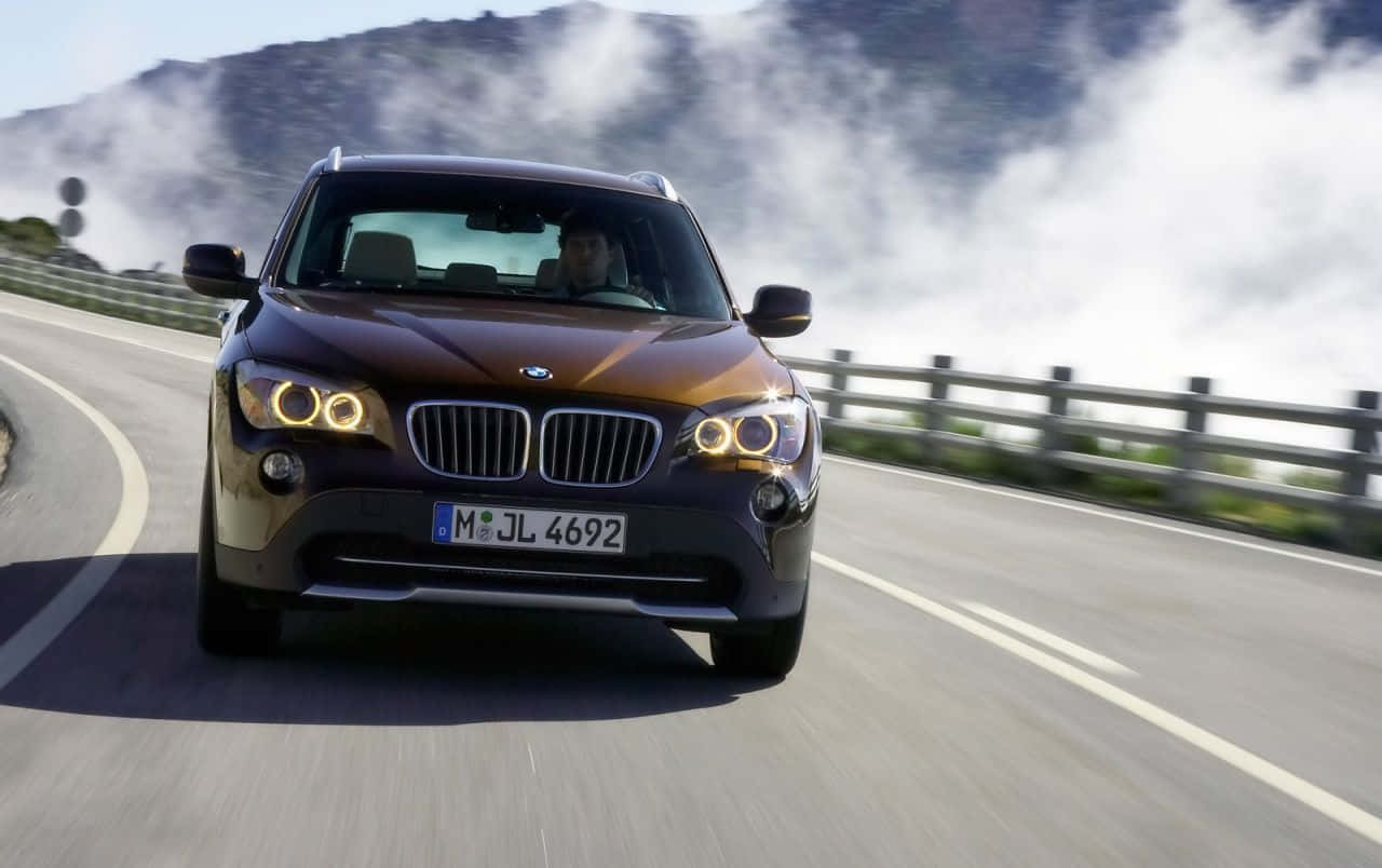 Sleek BMW X1 in a Striking Outdoor Setting Wallpaper