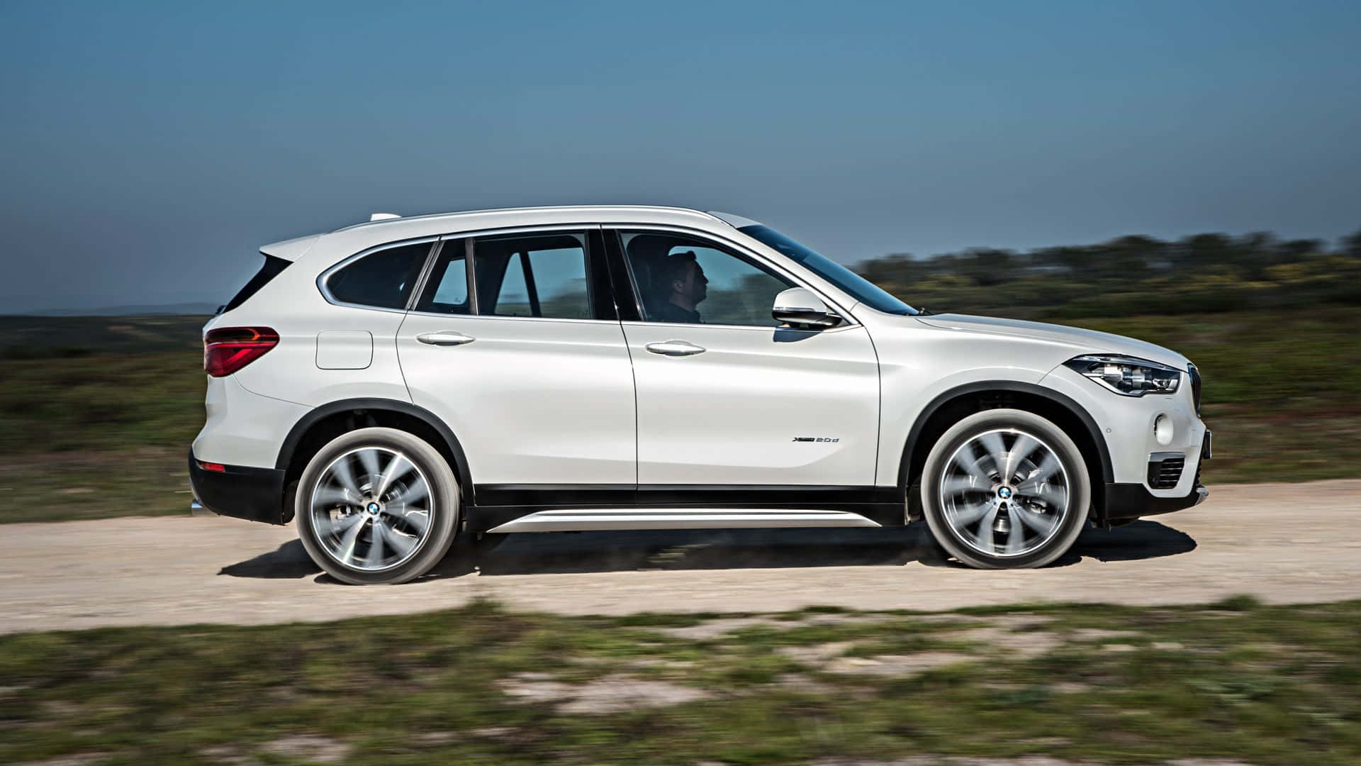 Sleek and Powerful BMW X1 on the Road Wallpaper