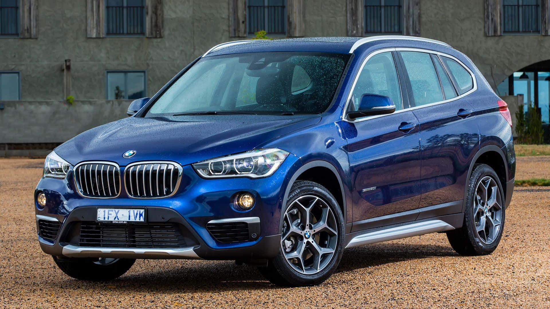 The Sleek and Stylish BMW X1 in Action Wallpaper