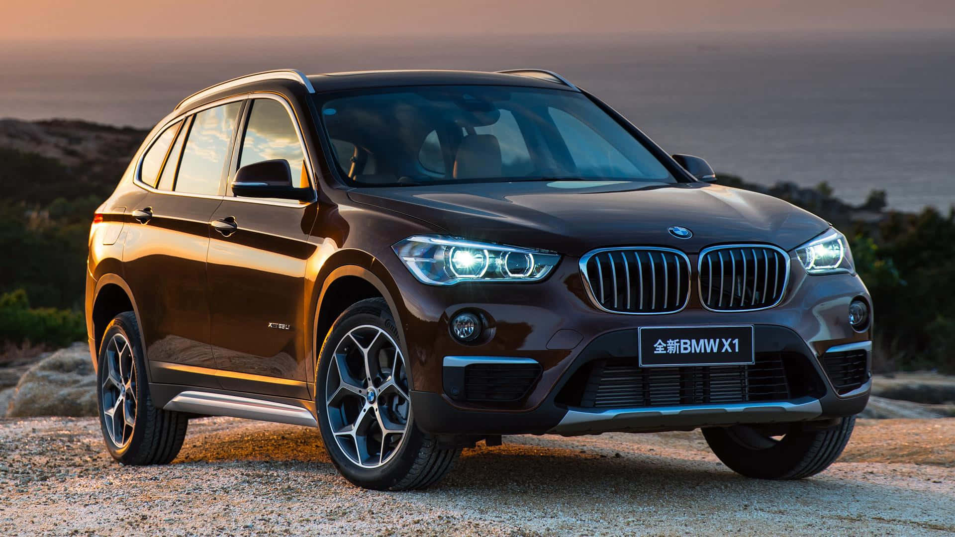 Stylish BMW X1 in Motion on the Road Wallpaper